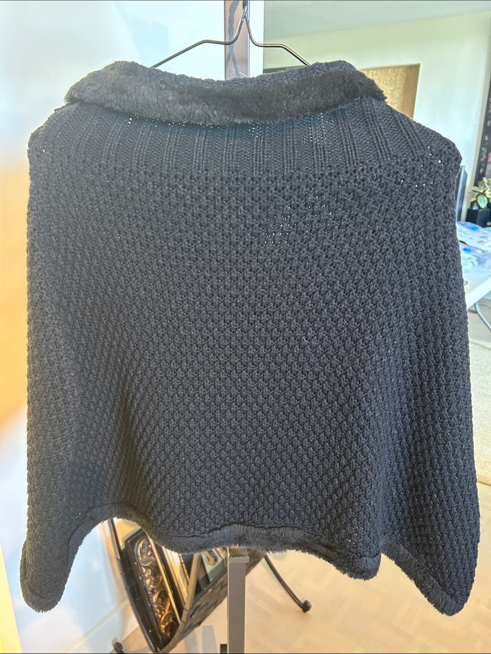 Sandros knit poncho Black Women's Knit Sweater with Faux-Fur Trim.